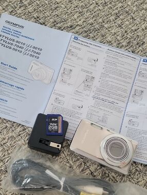 Olympus compact digital camera in champagne and silver